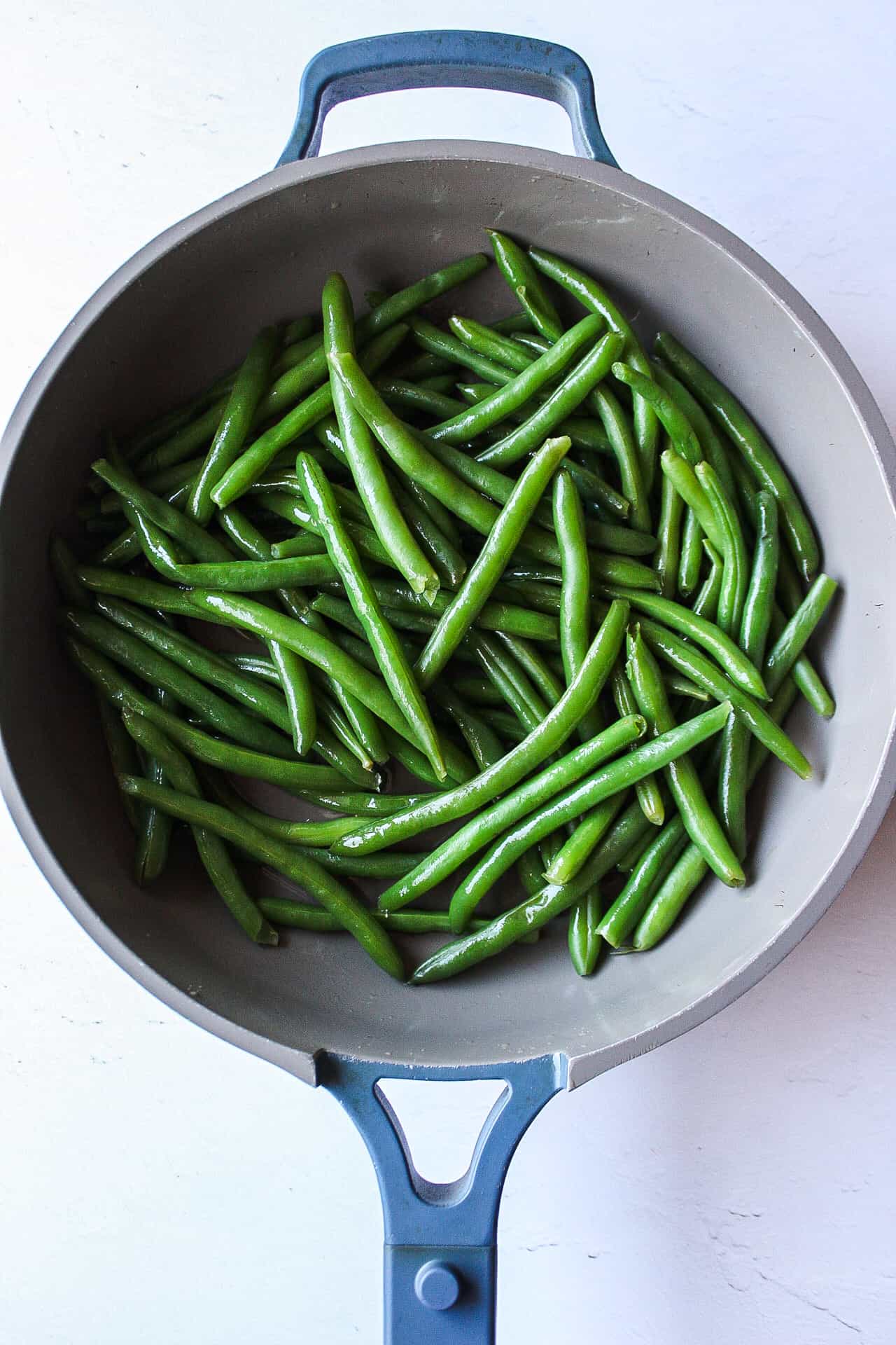 green beans in a skillet after being blanched