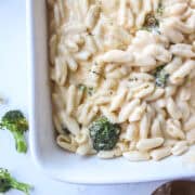 close up of broccoli macaroni and cheese in a platter.