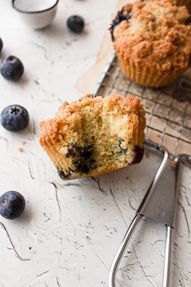 a close up of a muffin with a bite missing