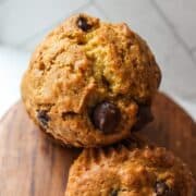 a close up of a pumpkin muffin with chocolate chips