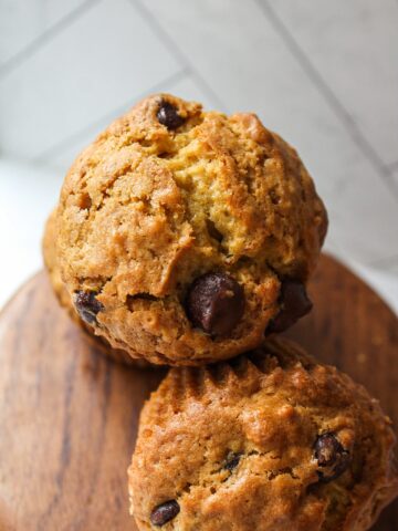 a close up of a pumpkin muffin with chocolate chips