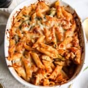 a casserole of baked pasta with vegetables topped with cheese