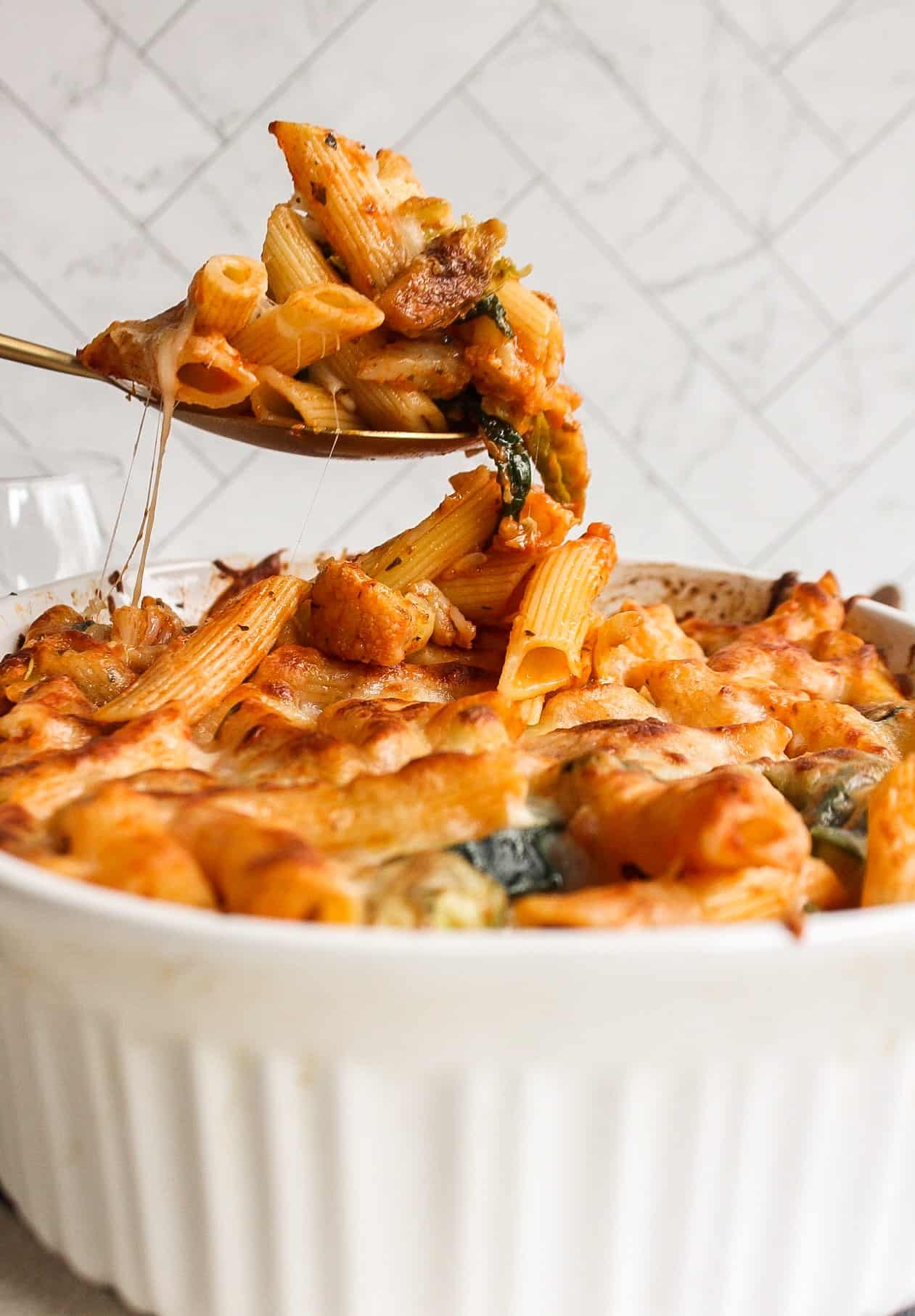 a spoonful of pasta bring brought out of the dish