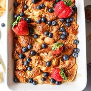 croissant french toast bake with berries on top.