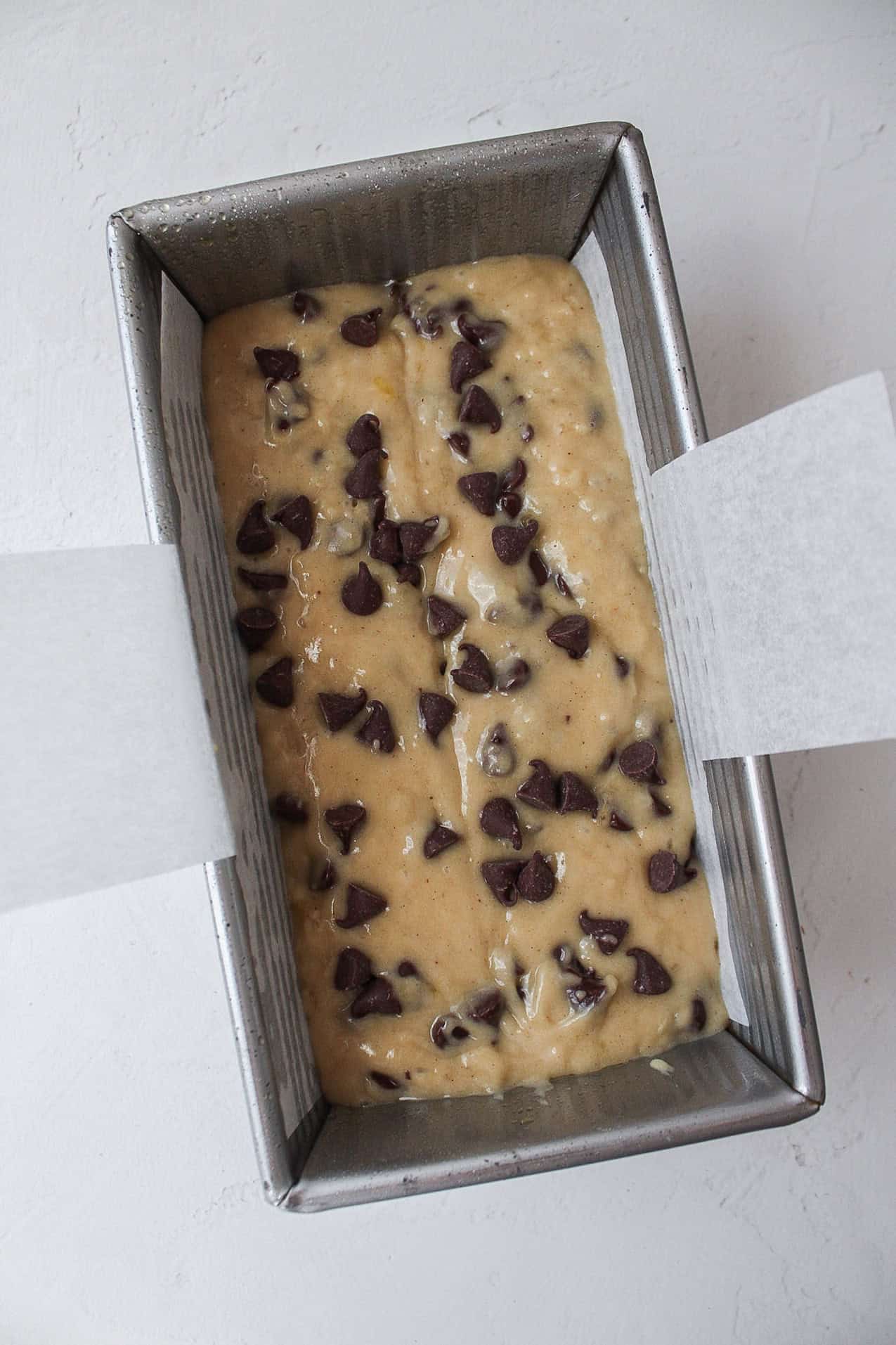 chocolate chip banana bread in a loaf pan.