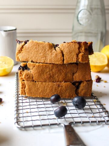 a stack of slices of a lemon blueberry bread