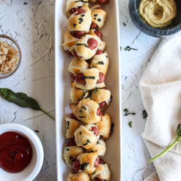 pigs in a blanket in a serving dish
