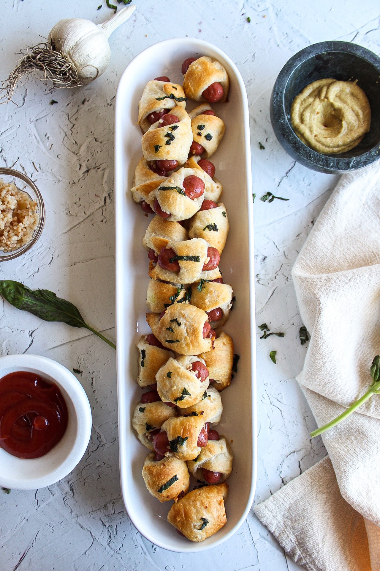 pigs in a blanket in a serving dish