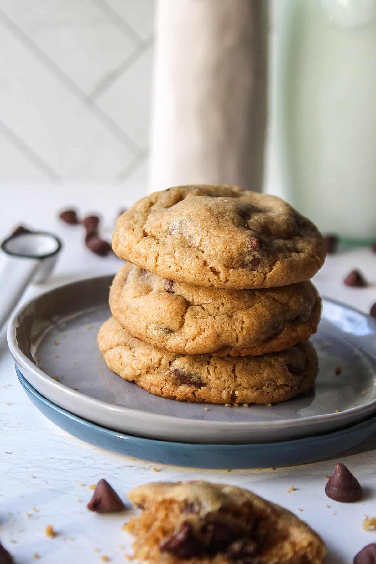 brown butter chocolate chip cookies stacked on a small plate