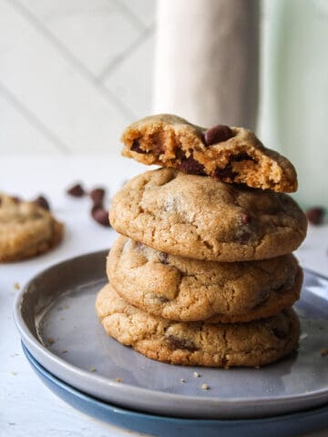 brown butter chocolate chip cookies stacked on a small plate