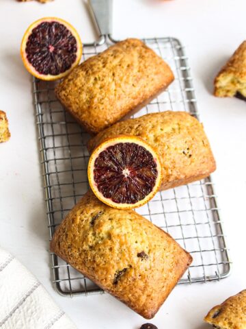 picture of three orange loaves with a slice of blood orange on top