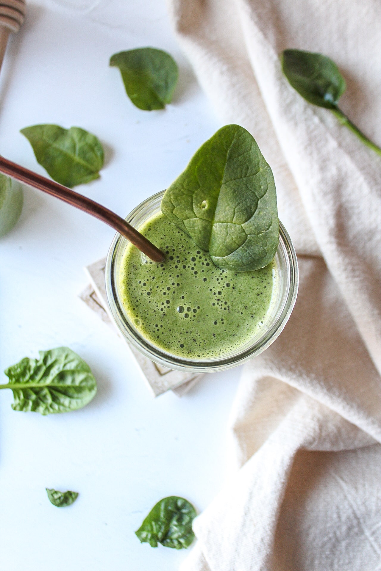 a glass of green smoothie