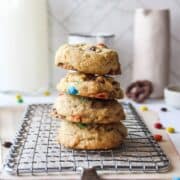 a stack of four cookies on a cooling rack
