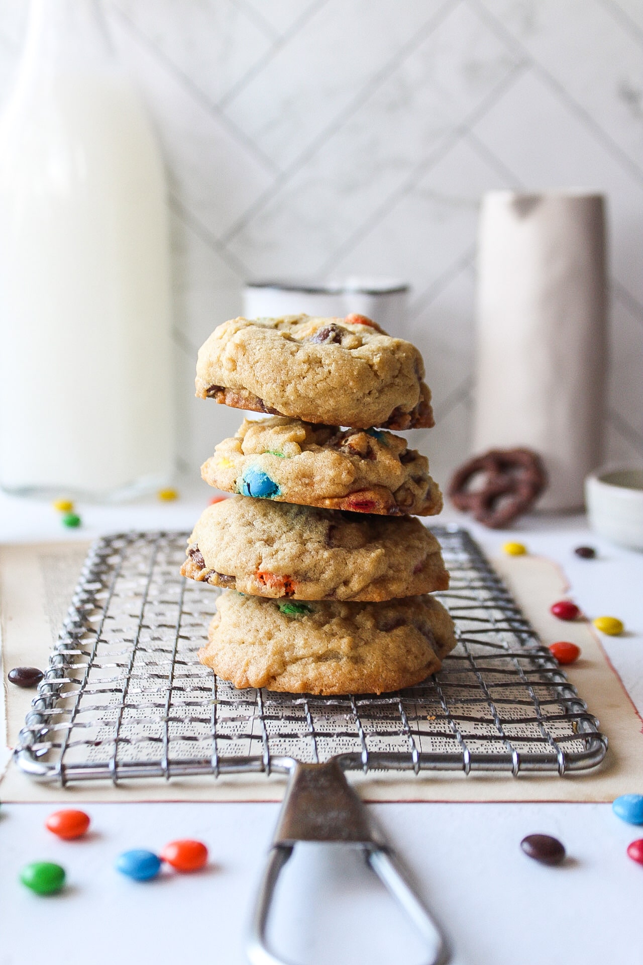 a stack of four cookies on a cooling rack