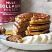 a stack of pancakes with banana and a few slices missing from the stack