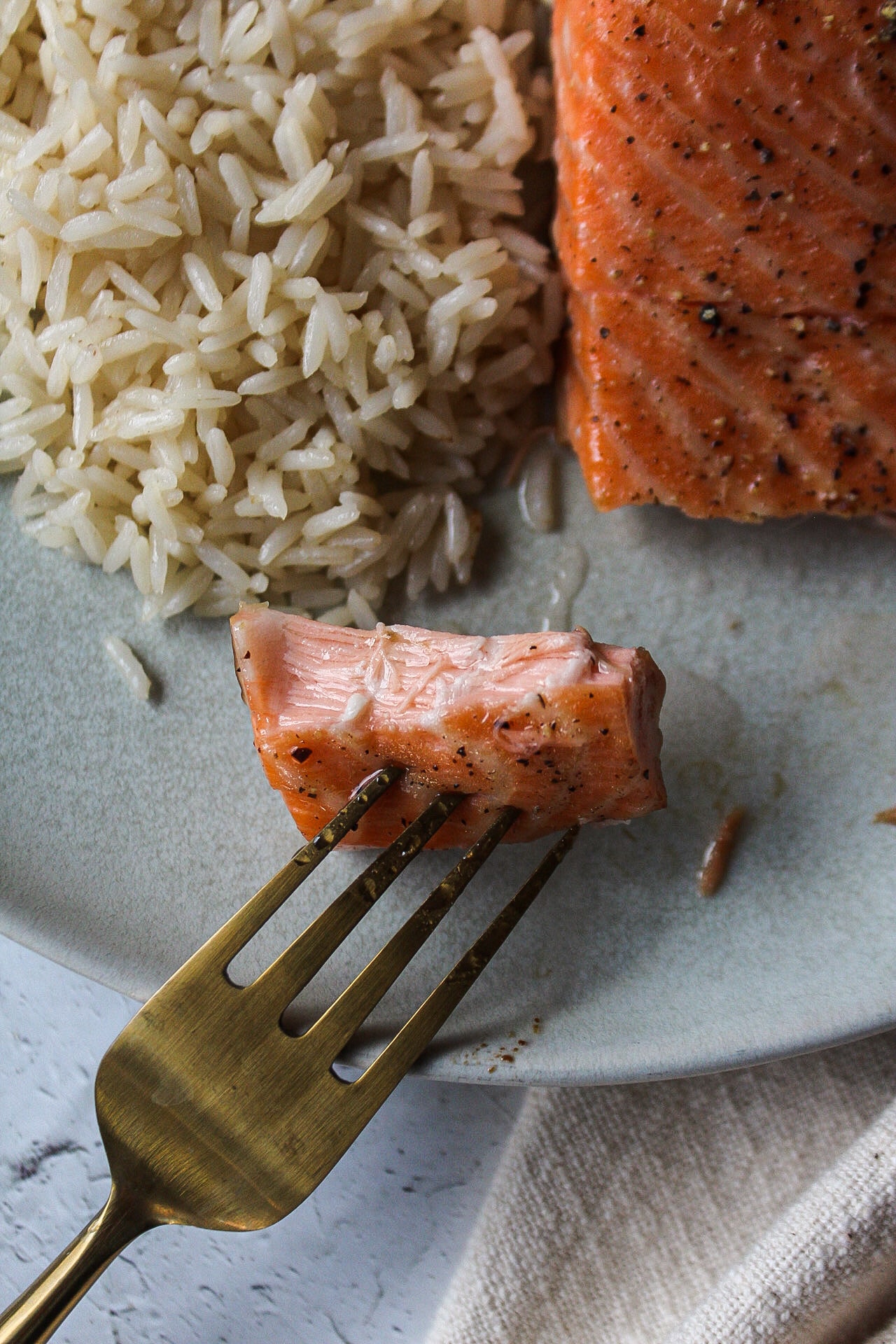 a piece of salmon on a fork