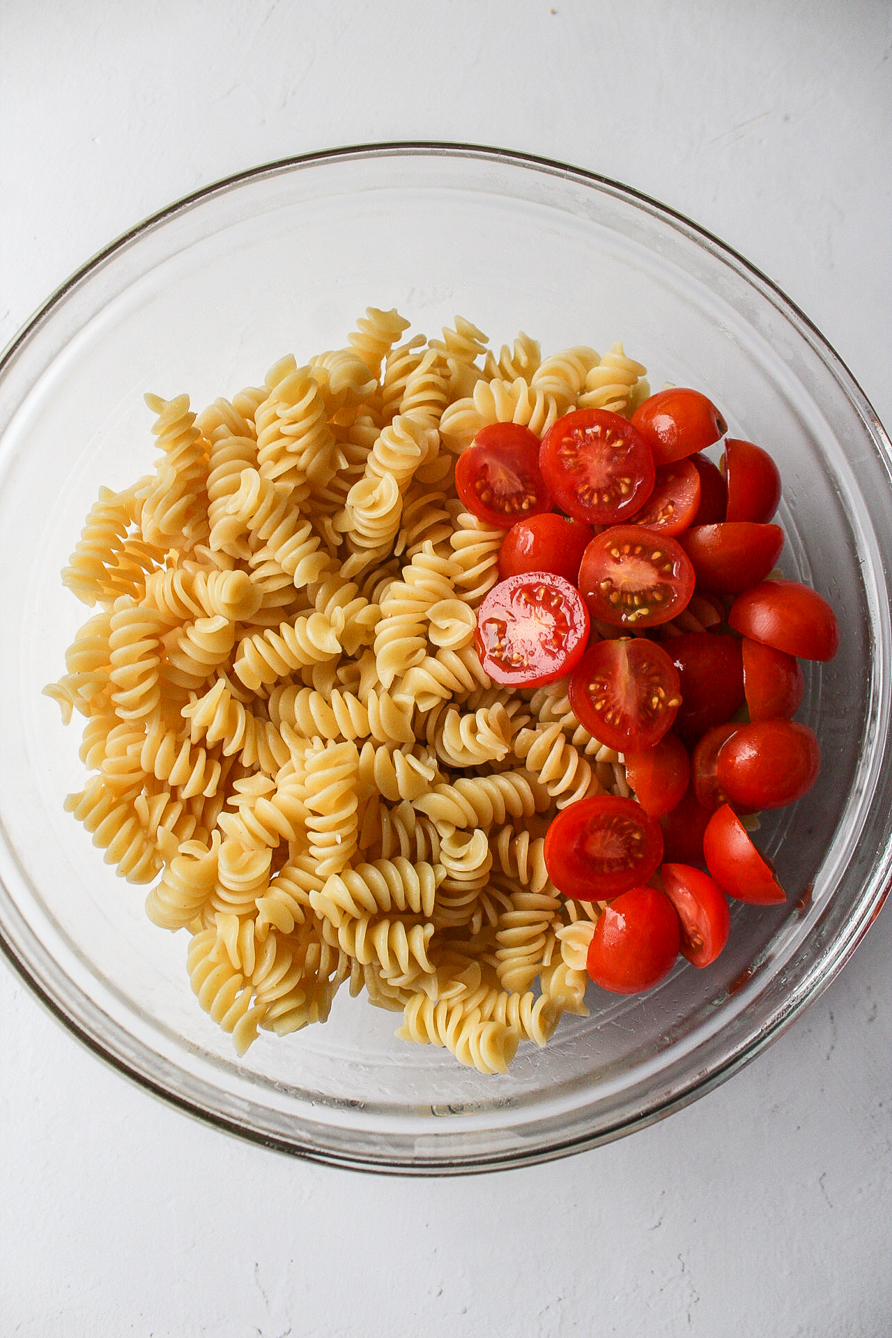 tomatoes and pasta in a bowl