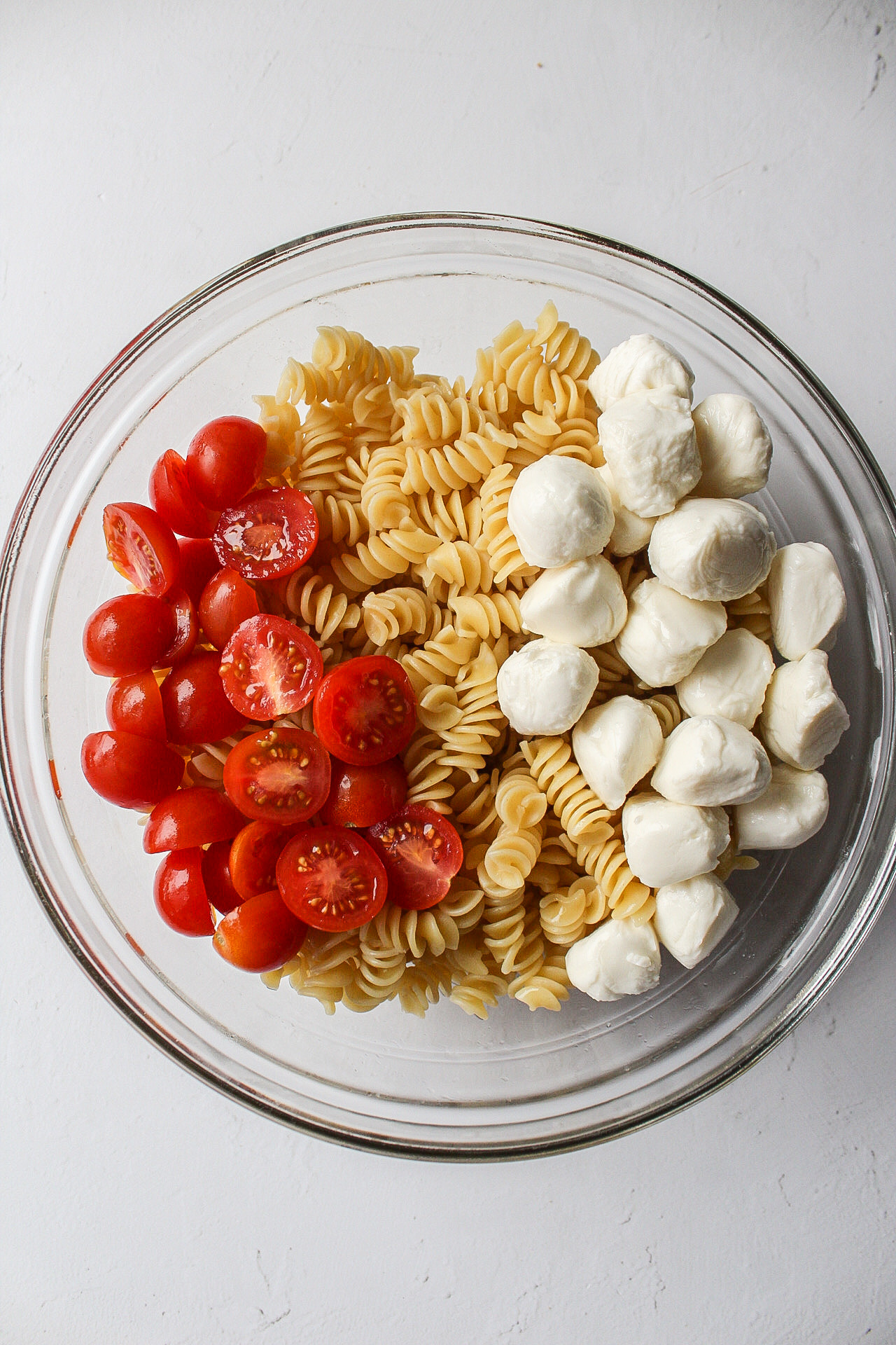 pasta with tomatoes and mozzarella in a large bowl