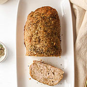 baked garlic herb chicken meatloaf on a plate