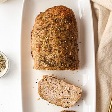 baked garlic herb chicken meatloaf on a plate