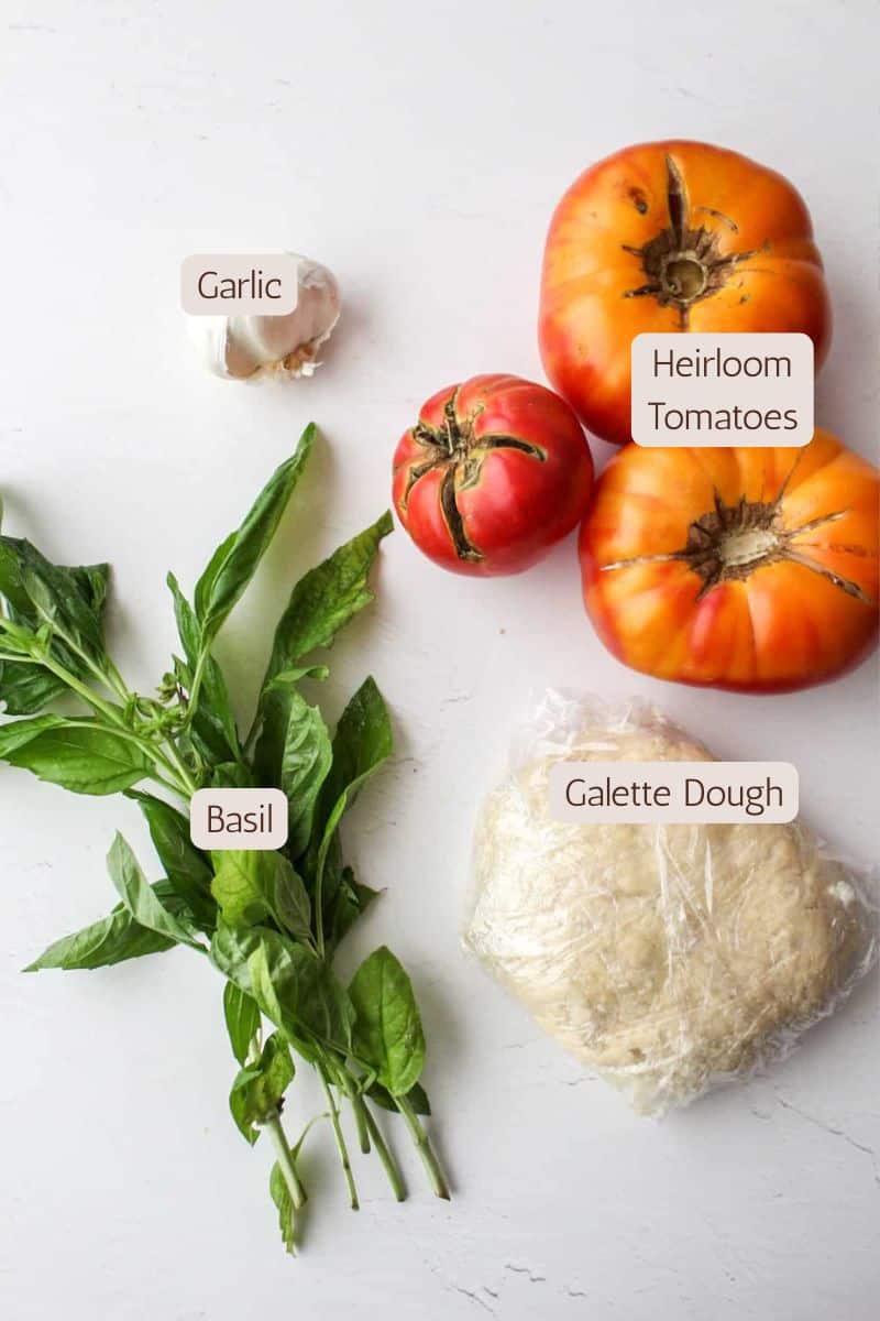Ingredients to make an heirloom tomato pesto galette.