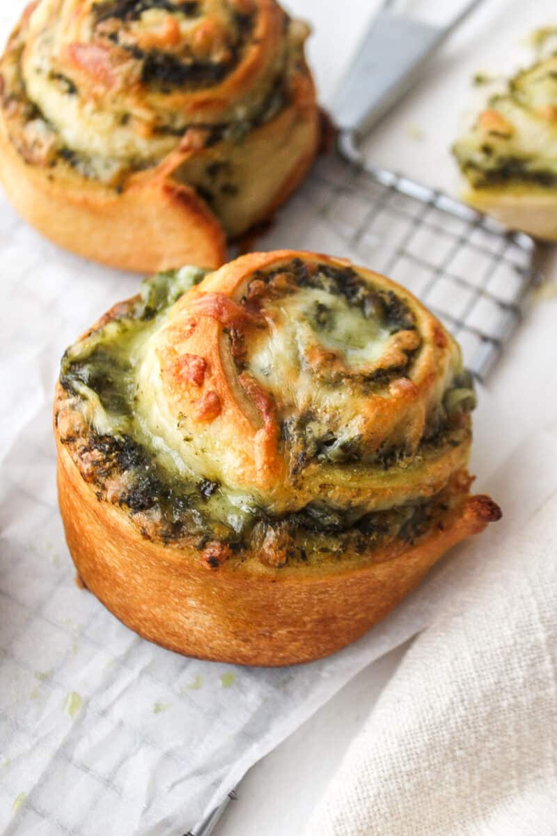 pesto pizza pinwheel on parchment paper