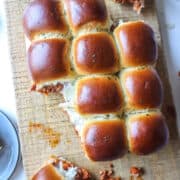 sloppy joe sliders on a wooden board