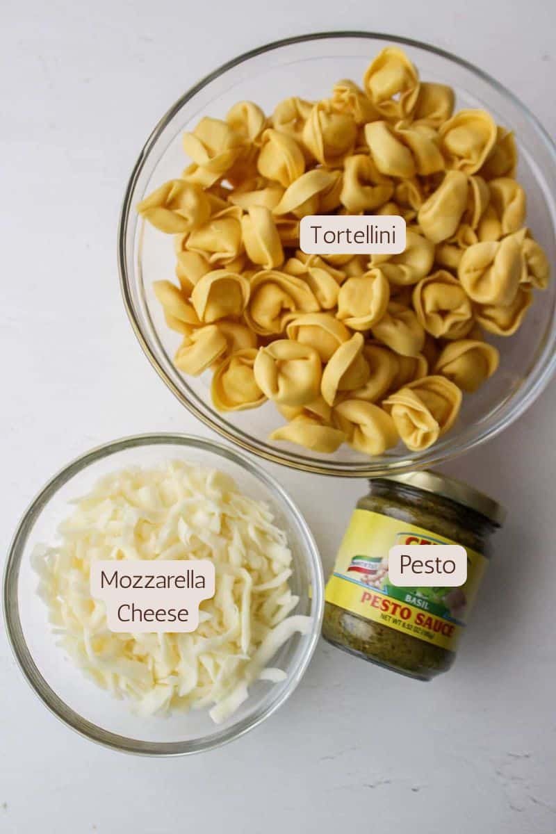 Three ingredients to make a cheesy pesto tortellini bake.