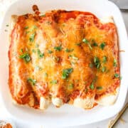 baked chicken enchiladas in a casserole dish