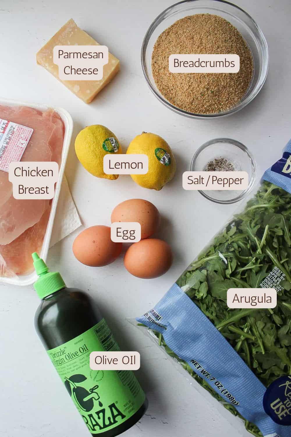 Ingredients to make chicken Milanese with arugula salad.