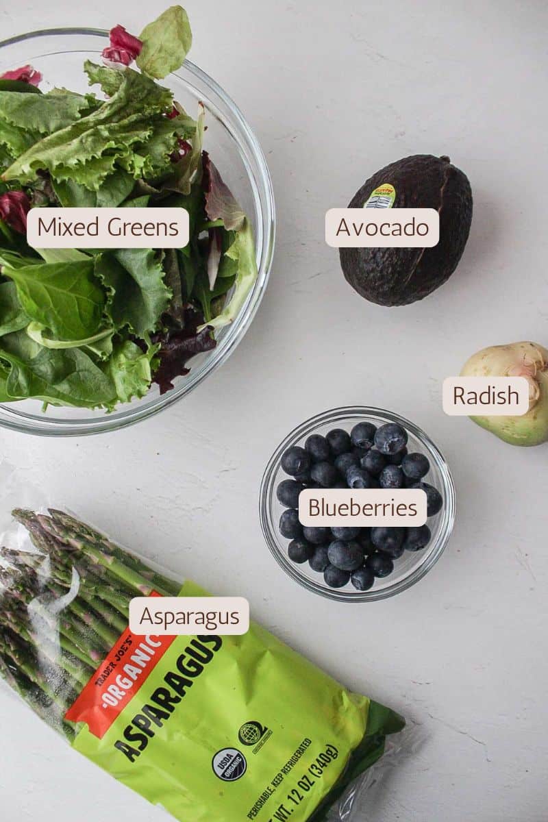 Ingredients to make a spring mixed greens salad.