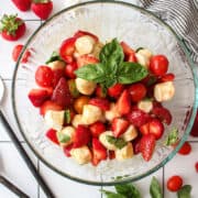 strawberry basil and mozzarella salad in a bowl.