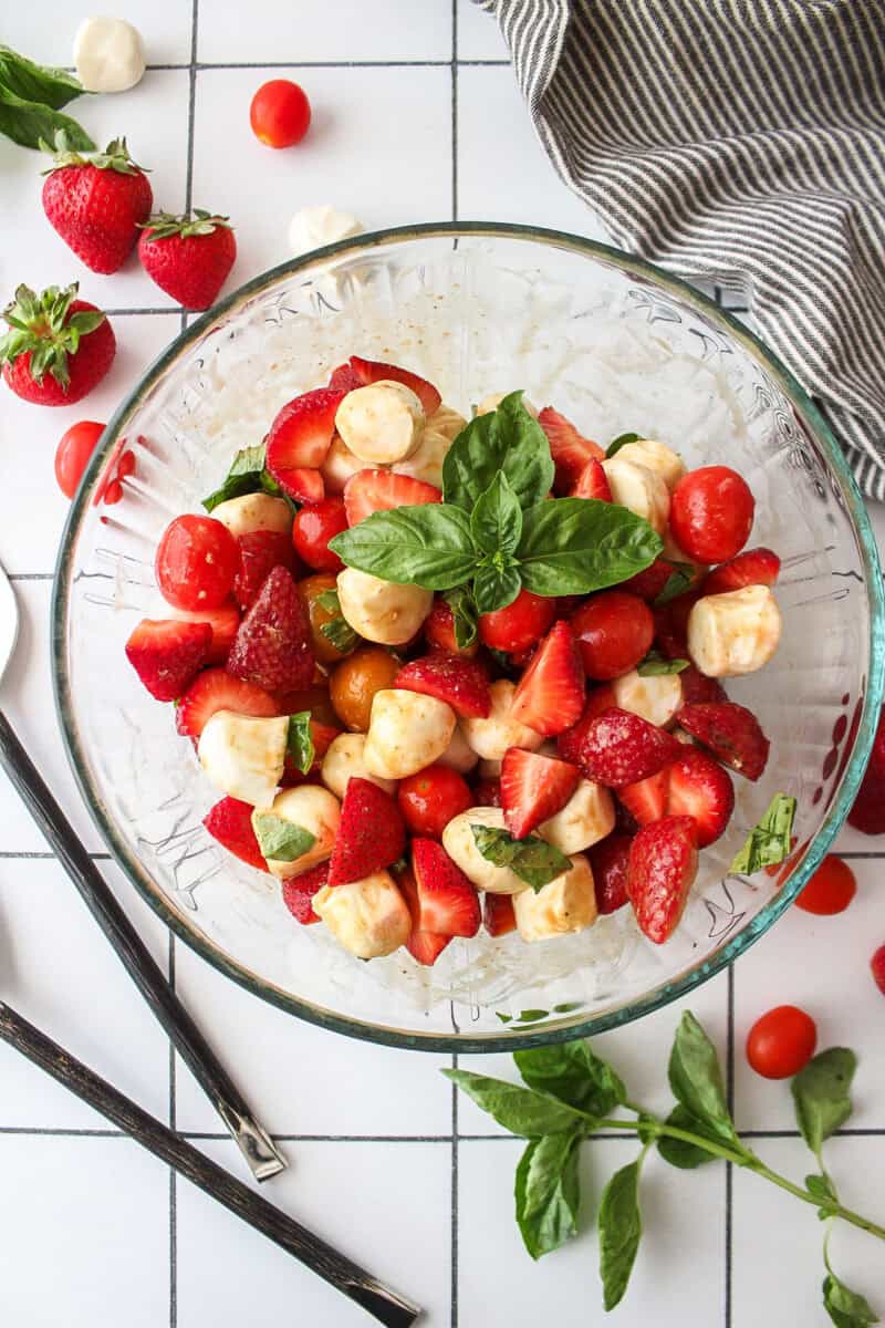 strawberry basil and mozzarella salad in a bowl.