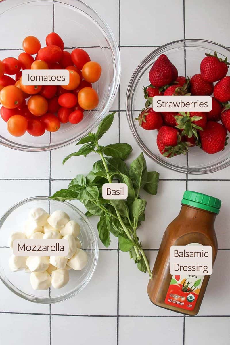 Ingredients to make a strawberry basil caprese salad.