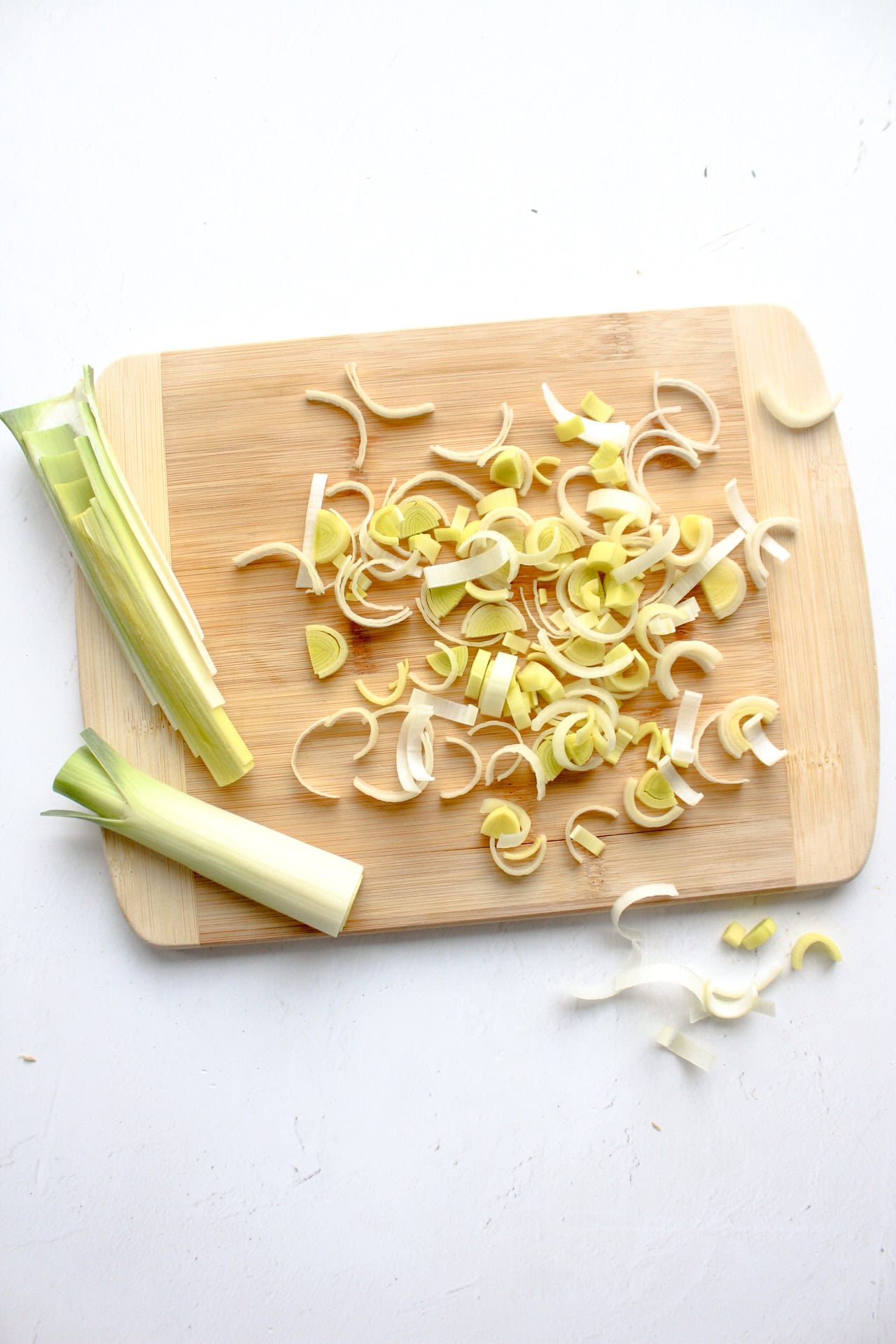 Chopped leeks on a cutting board.
