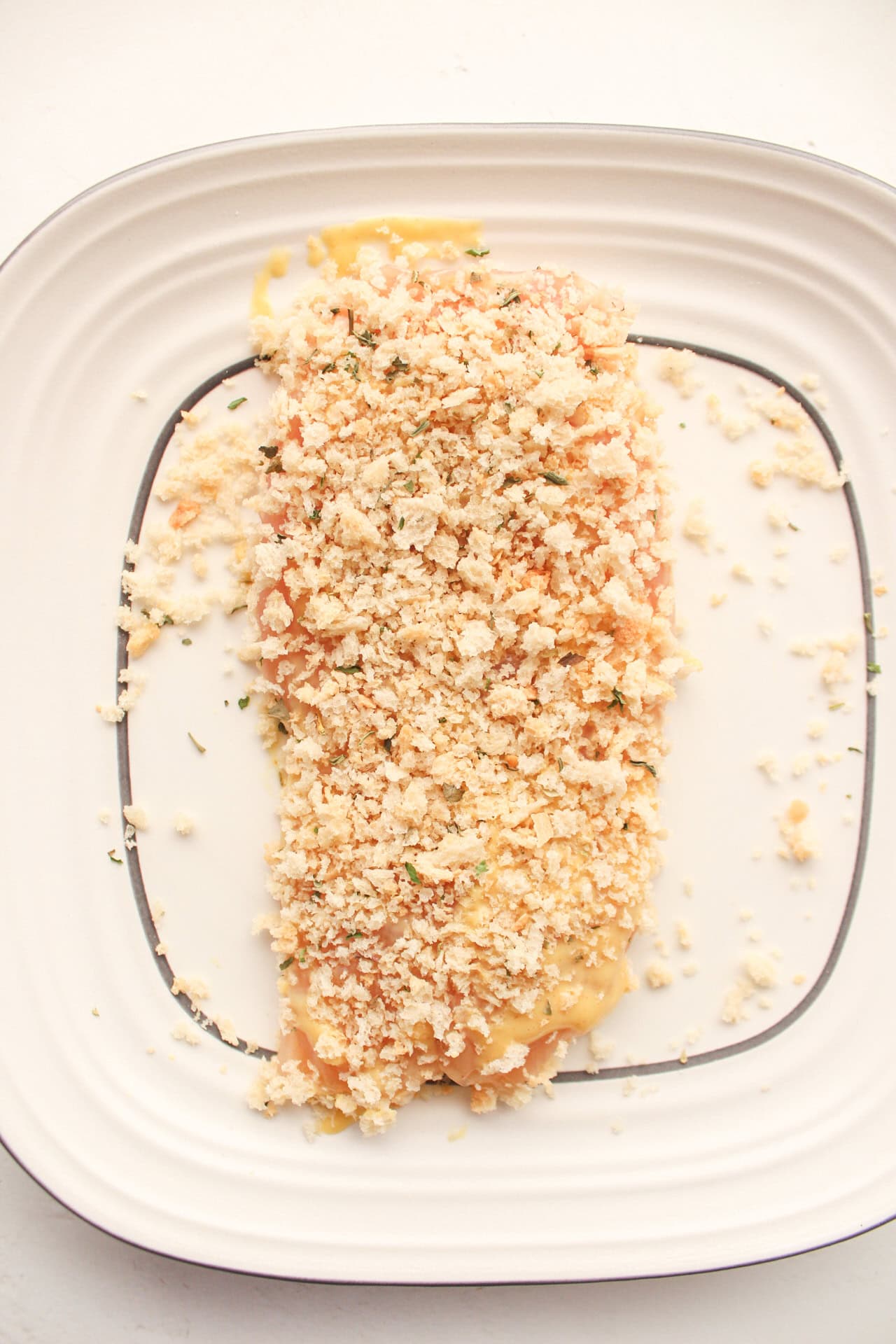 Breaded honey mustard chicken on a plate.