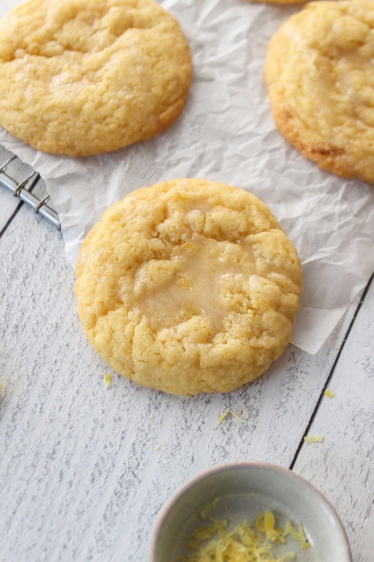 sugar cookie on a cooling rack with parchment paper.