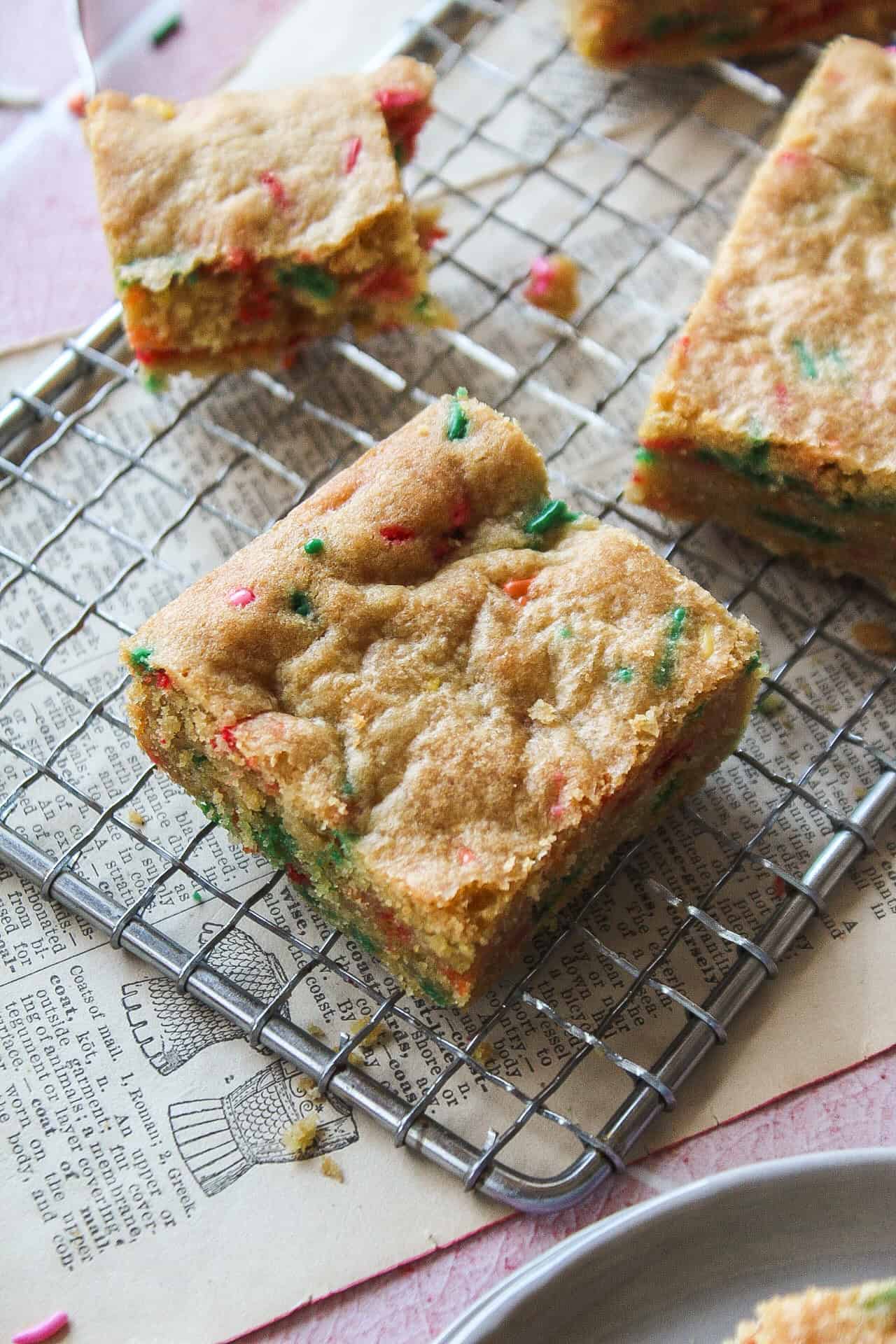 Close up of a funfetti blondie on a cooling rack.