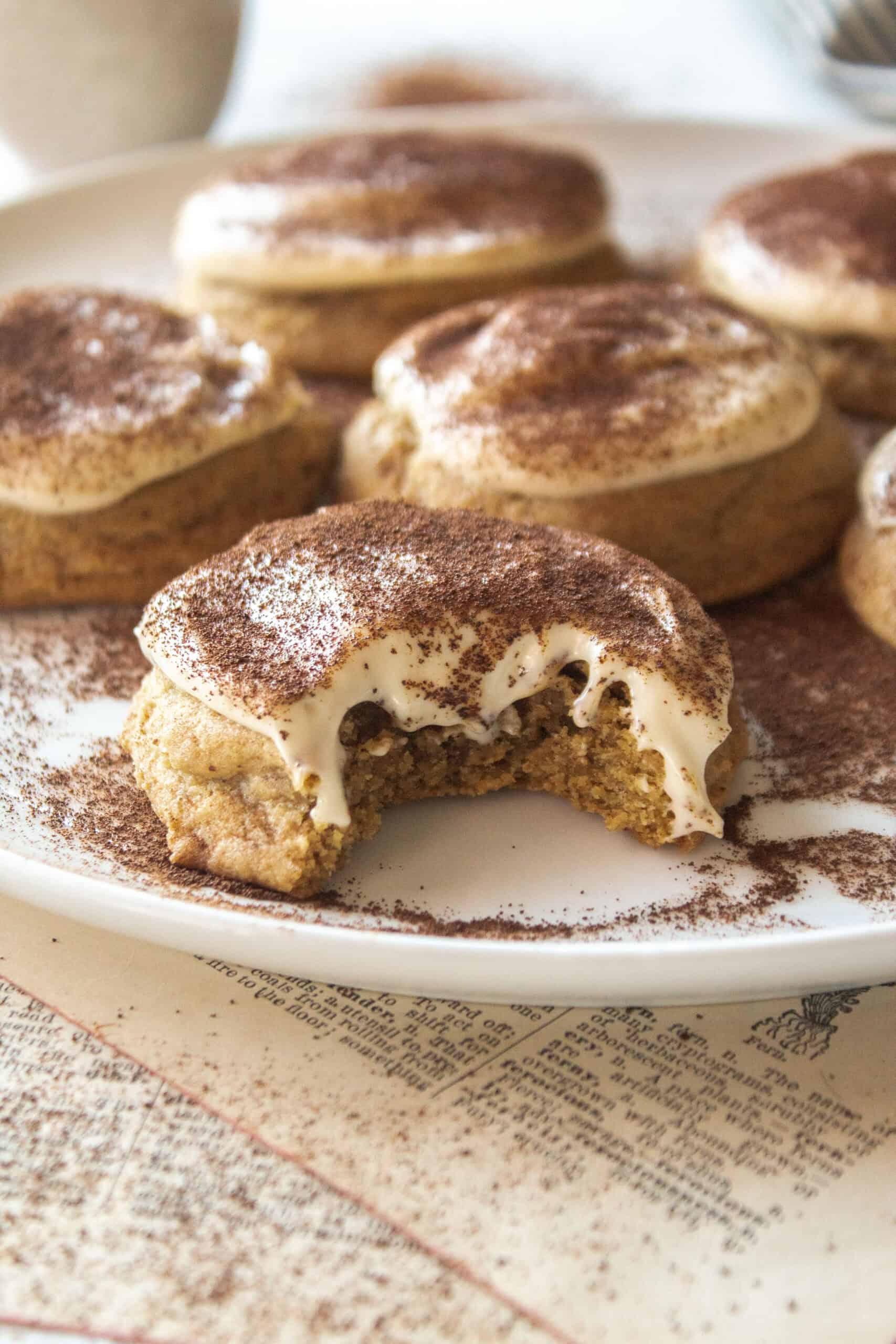 Bite shot of tiramisu cookies on a plate.