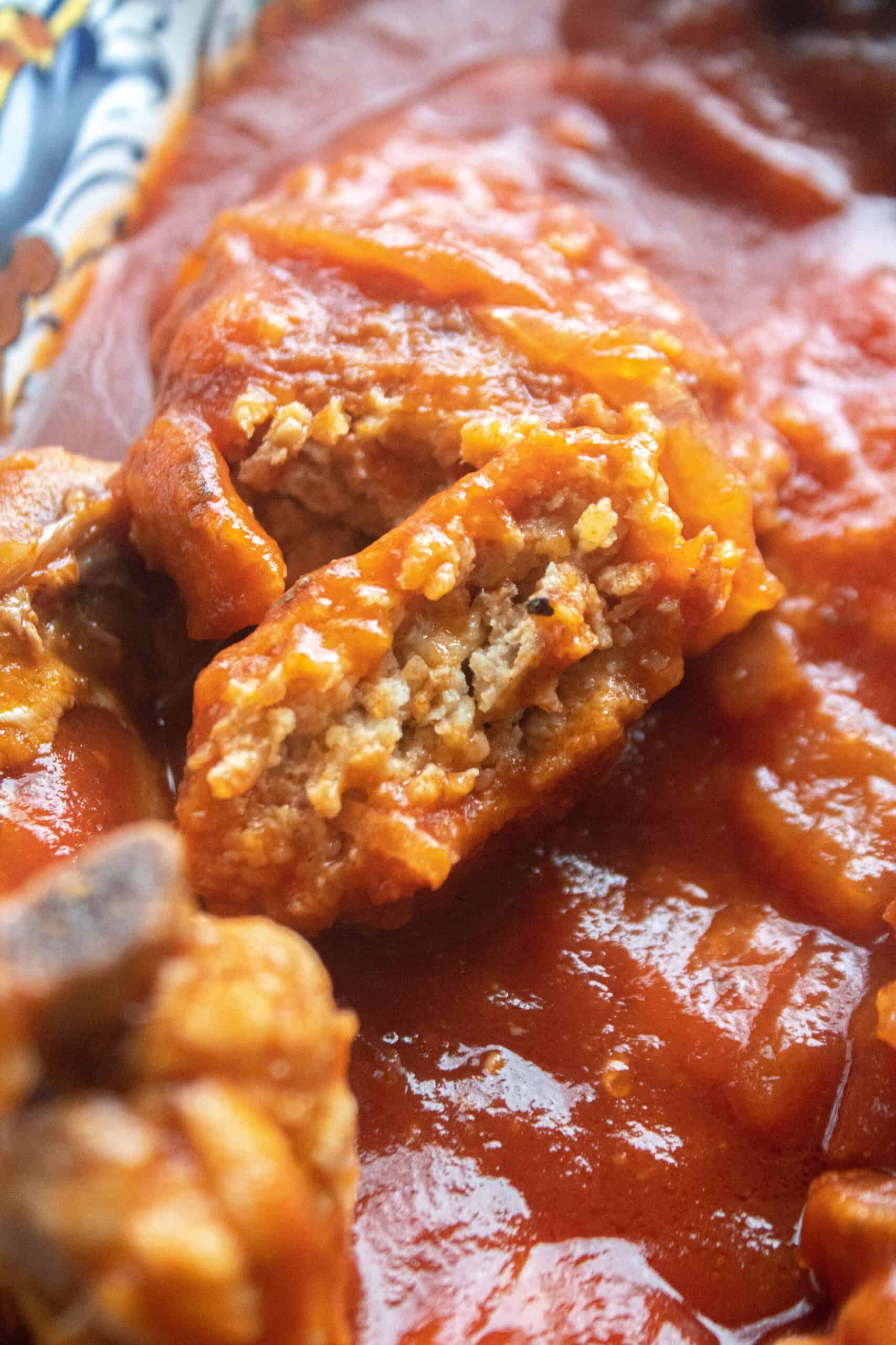 close up of a piece of a chicken patty cut open.