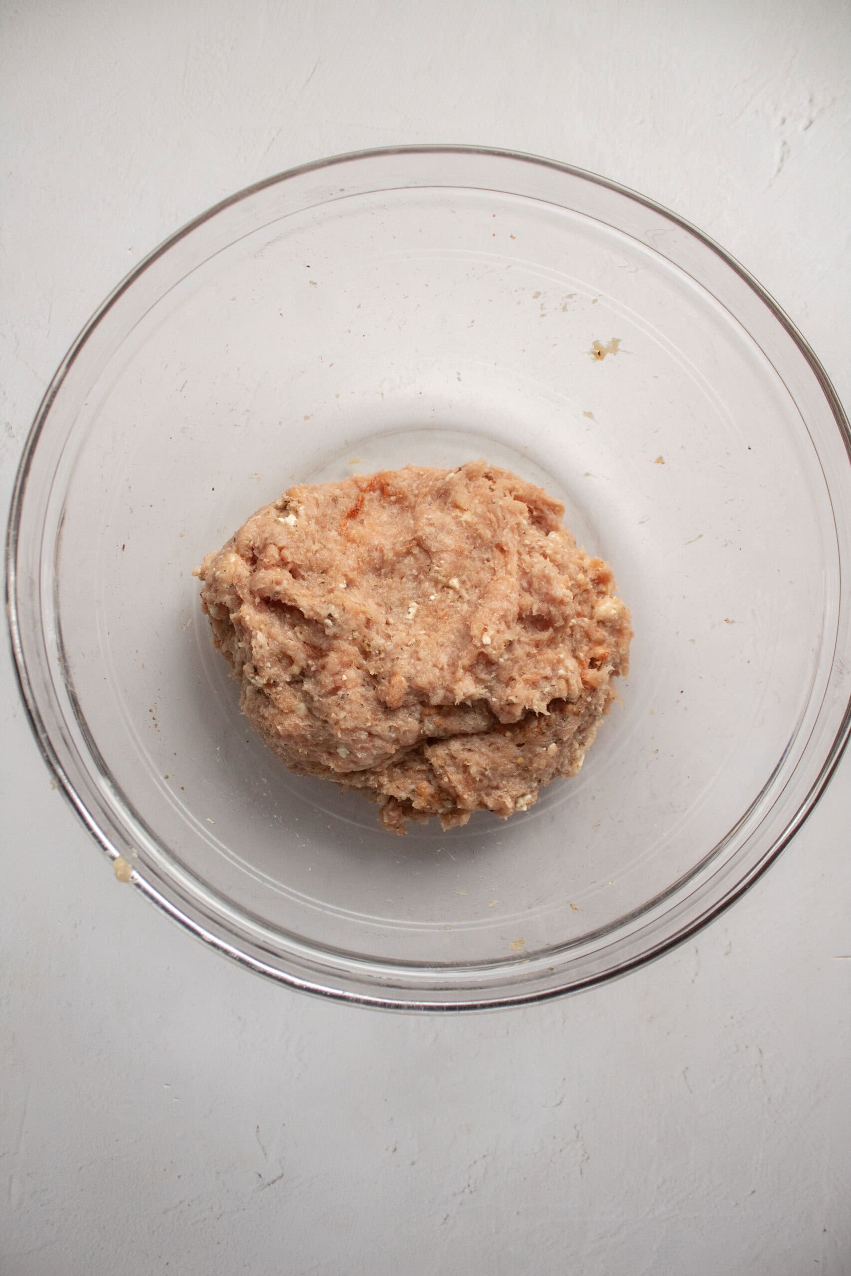 greek chicken burger mixed meat in a large bowl.
