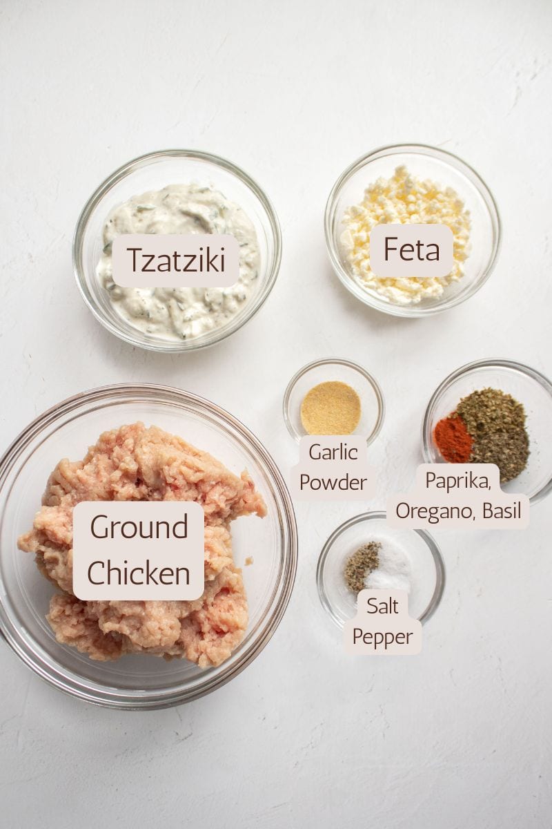 Ingredients to make greek chicken burgers with tzatziki sauce.