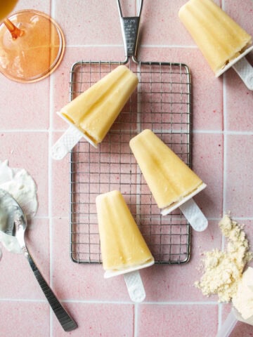 mango yogurt popsicles on a cooling rack.