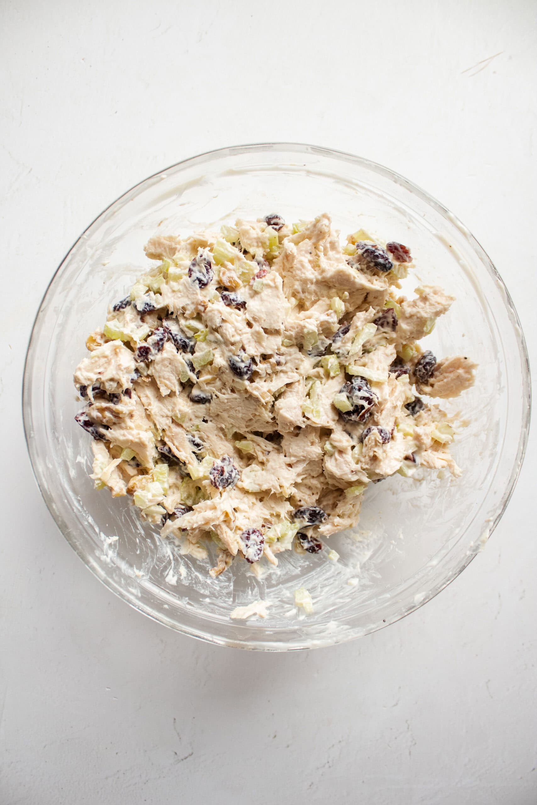 Chicken salad in a mixing bowl, combined.