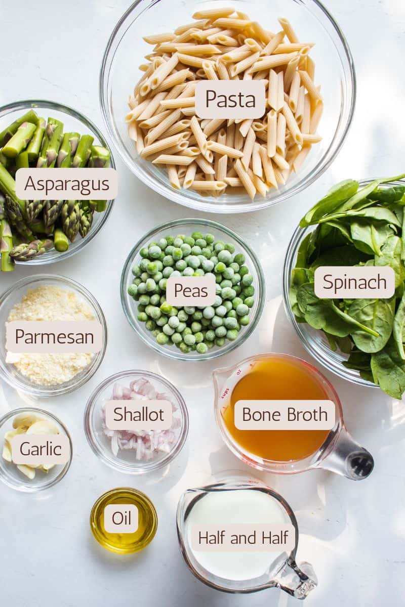 Ingredients to make a creamy one pot pasta with asparagus and spinach.