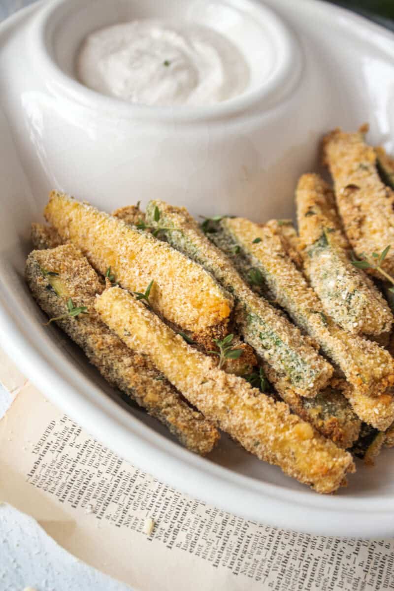 Air fryer zucchini fries in a bowl.