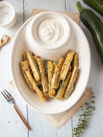 Air fryer zucchini fries in a bowl.