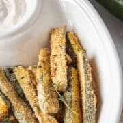 Air fryer zucchini fries in a bowl.
