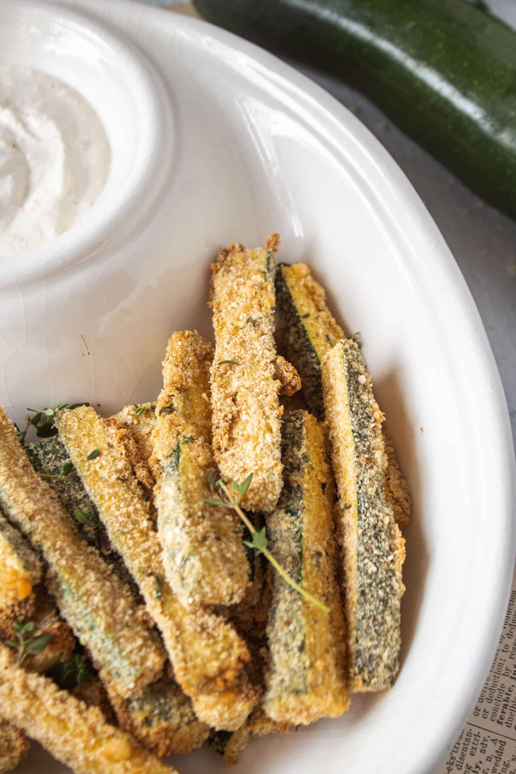 Air fryer zucchini fries in a bowl.