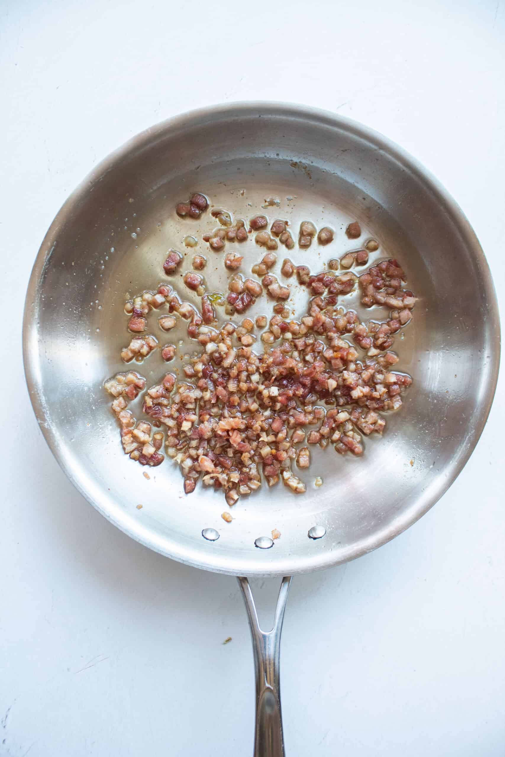 Sautéed pancetta in a medium sauce pan.